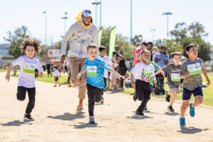 Olympian Chris Benard racing young athletes